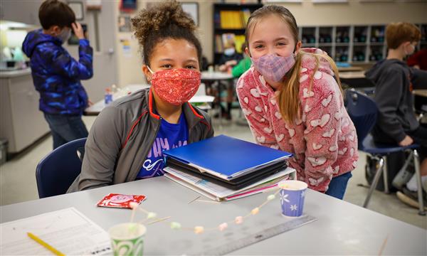 students work to build a bridge